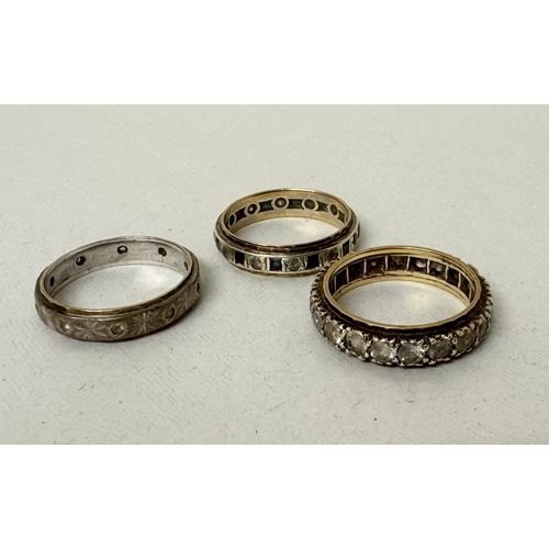 414 - Three vintage 9ct gold and silver stone set eternity rings.  Gross weight 11.5g
