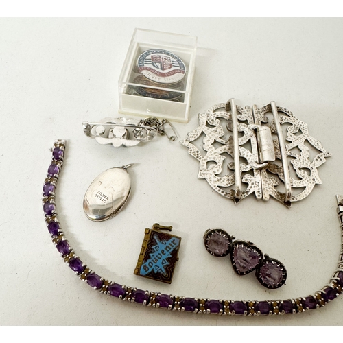 415 - A hallmarked silver nurses buckle - 32g, a silver and amethyst line bracelet, sweetheart brooch, sil... 