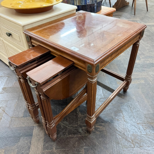 A square mahogany coffee table on reeded legs with two tuck away tables ...