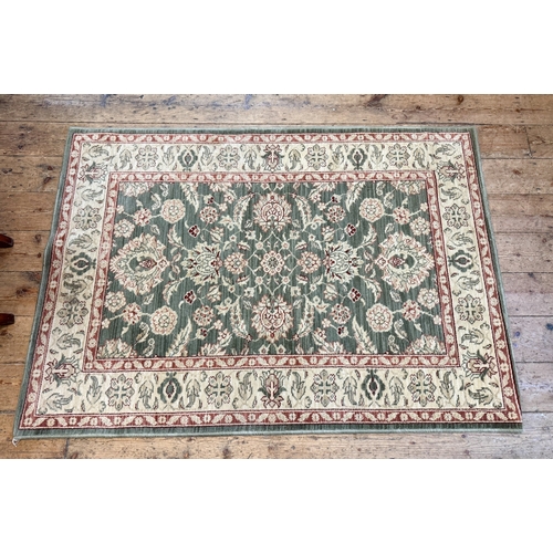 A green and fawn patterned wool pile rug approx. 6' x 4'