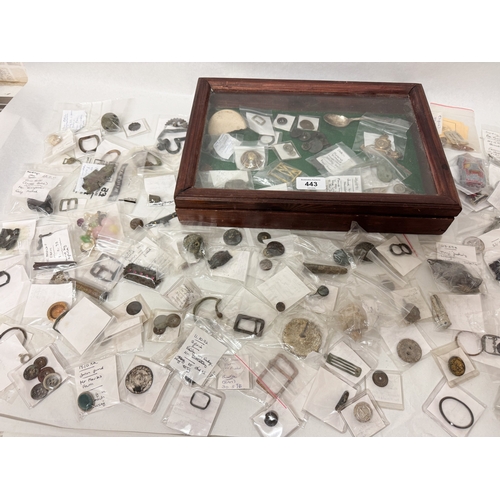 A glass topped display cabinet containing over one hundred metal ...