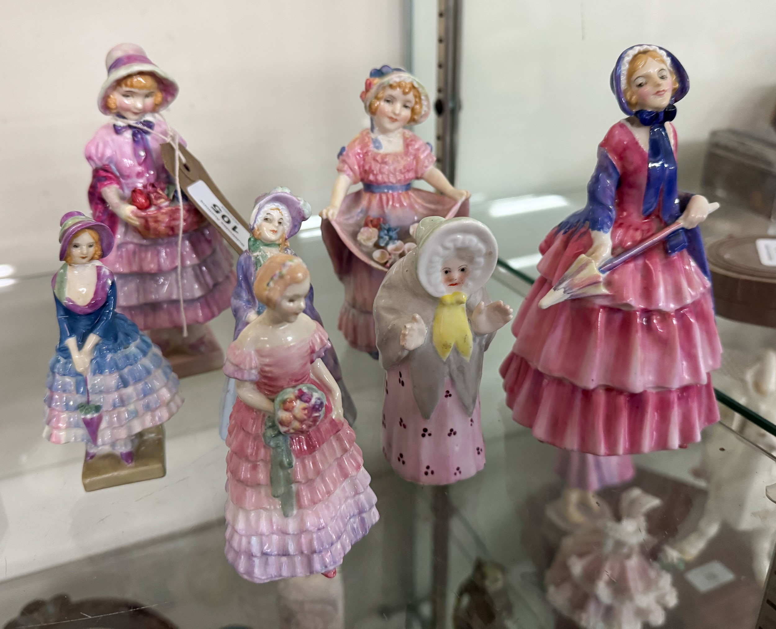 A collection of six early Royal Doulton small crinoline lady figurines ...
