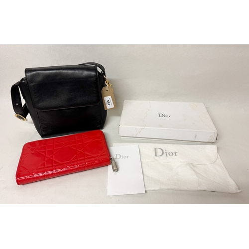 541 - A black leather handbag with Dior labels and a red quilted gloss clutch bag in Dior box