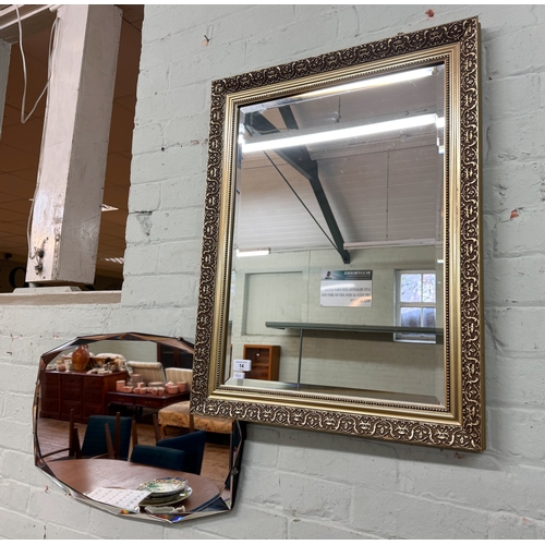 14 - A bevelled wall mirror in gilt frame together with a frameless bevelled mirror