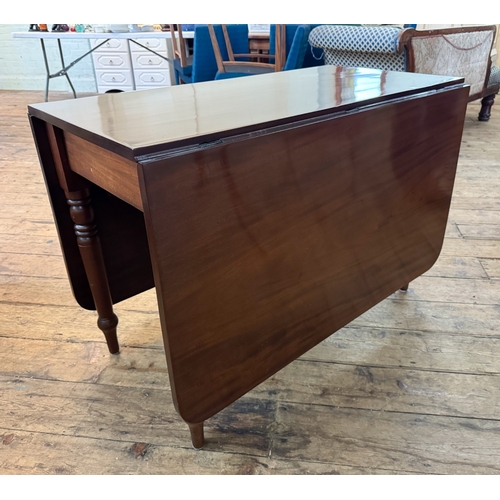 37 - An early Victorian mahogany drop leaf dining table on turned legs, 3'6