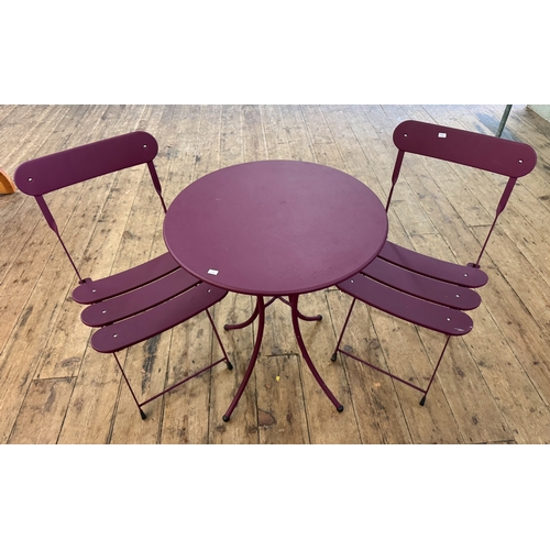 46 - A modern mauve circular bistro table with two matching chairs