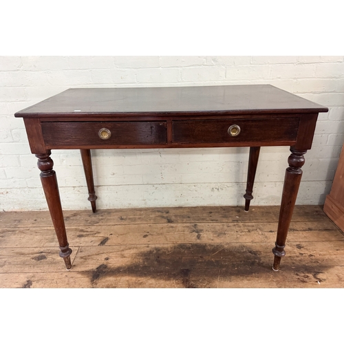 56 - An Edwardian mahogany side table fitted two drawers on turned legs, 3'6