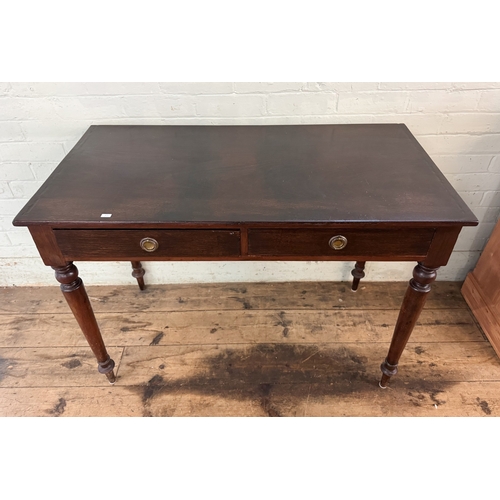 56 - An Edwardian mahogany side table fitted two drawers on turned legs, 3'6