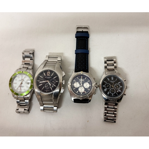 576 - A collection of four modern gent's dress watches of various styles