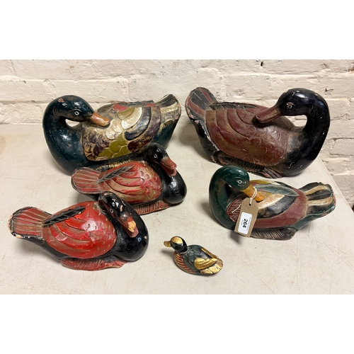99 - A collection of polychrome carved wooden Decoy ducks