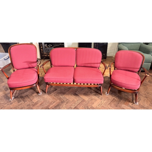 89 - An Ercol vintage three piece lounge suite in the Windsor style with original burgundy cushions