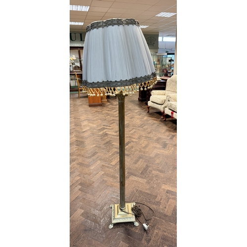 92 - A Corinthian column brass standard lamp with bobbled shade