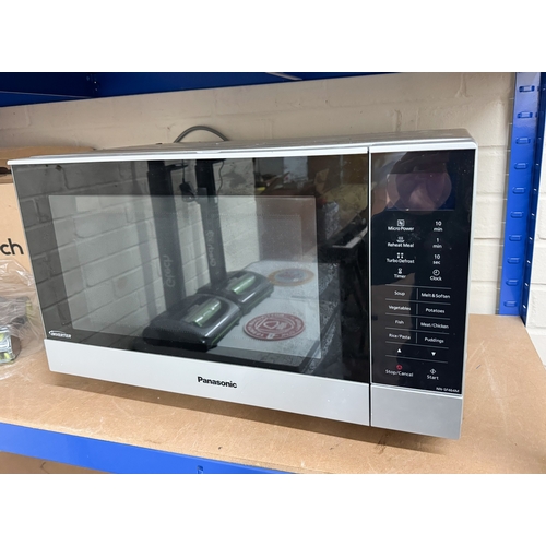 643 - A Panasonic inverter microwave in silver casing