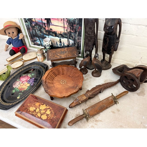 645 - Collectables to include a wooden canon shaped wine bottle holder, brass inlaid fruit bowl, tribal fi... 