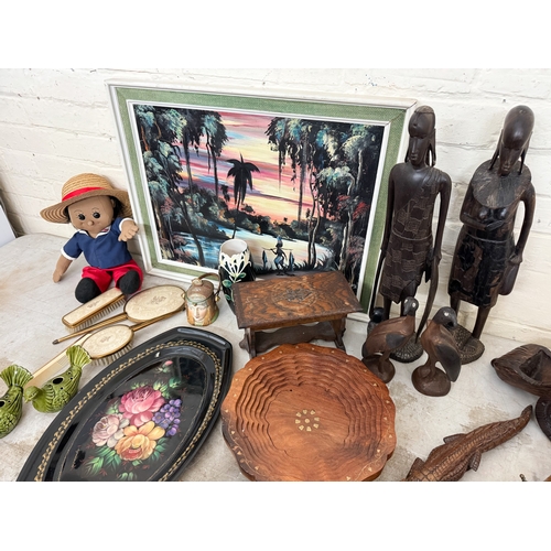 645 - Collectables to include a wooden canon shaped wine bottle holder, brass inlaid fruit bowl, tribal fi... 