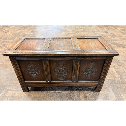 168 - A late Victorian oak three panel coffer with carved fronts, 3' wide