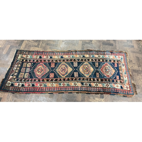 154 - A blue and patterned wool pile Persian runner, 7'6