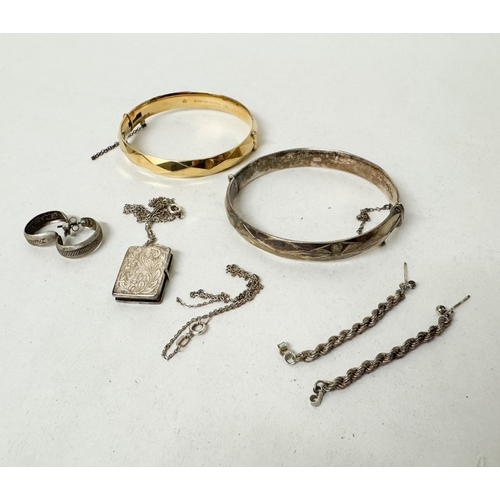 558 - A silver bangle and other pieces of small silver jewellery, 56 grams,  and a rolled gold hinged bang... 