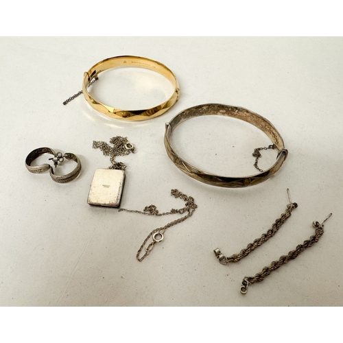 558 - A silver bangle and other pieces of small silver jewellery, 56 grams,  and a rolled gold hinged bang... 