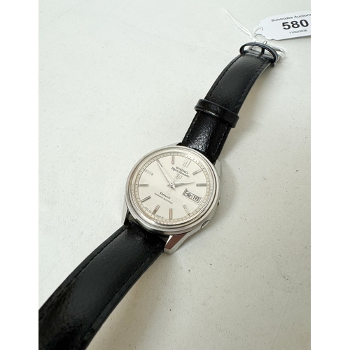 580 - Seiko 5 Sportsmatic automatic calendar wrist watch on black leather strap.