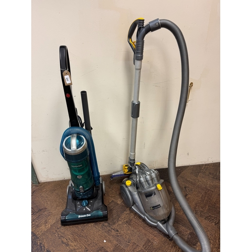 662 - A Dyson cylinder vacuum cleaner together with a Hoover Breeze upright vacuum cleaner