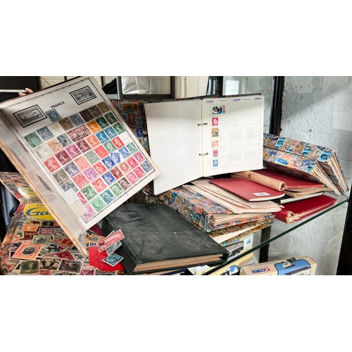 589 - A collection of stamp albums to include World stamps