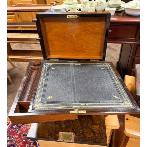 310 - A Victorian walnut travelling case with drop flap and concealed drawer opening to reveal a writing s... 