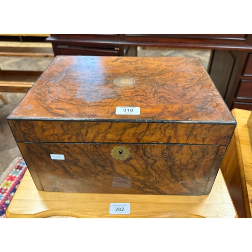 310 - A Victorian walnut travelling case with drop flap and concealed drawer opening to reveal a writing s... 