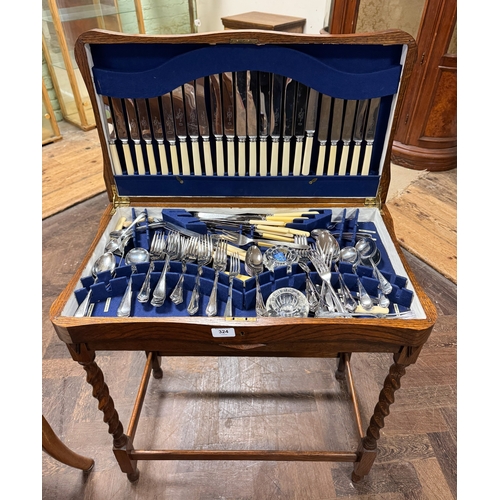 324 - A 1930's oak barley twist canteen containing Thomas Ward and Sons, Sheffield, plate cutlery