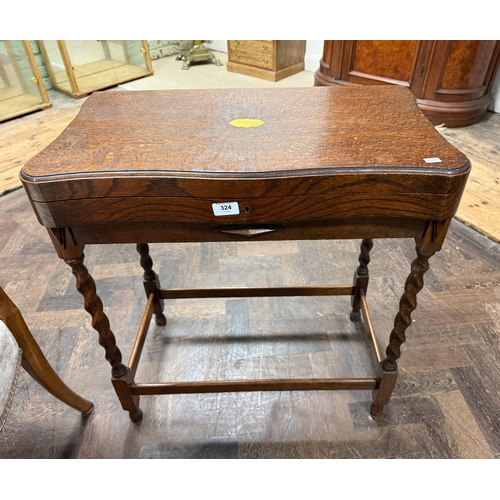 324 - A 1930's oak barley twist canteen containing Thomas Ward and Sons, Sheffield, plate cutlery