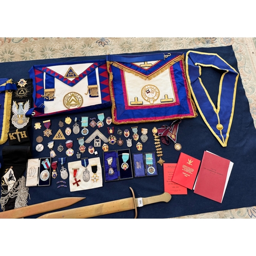 145 - A quantity of assorted masonic regalia to include jewels and swords etc