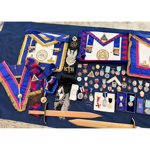 145 - A quantity of assorted masonic regalia to include jewels and swords etc