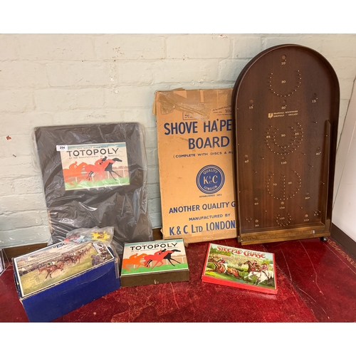 254 - A collection of vintage games to include Totopoly Horse racing game and a Shove'appeny board plus ot... 