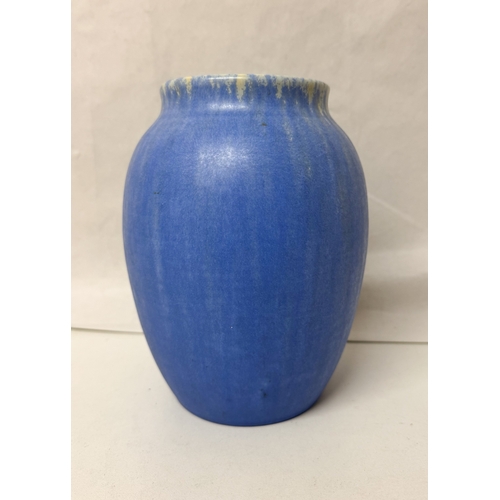 256 - A ceramic Ruskin blue coloured drip glazed vase
