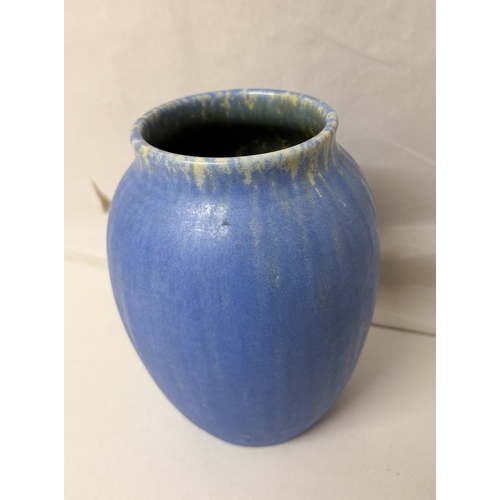 256 - A ceramic Ruskin blue coloured drip glazed vase