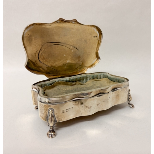 396 - A hallmarked silver shaped jewellery trinket box. 13cms across. Hallmarked Chester 1907. Gross weigh... 