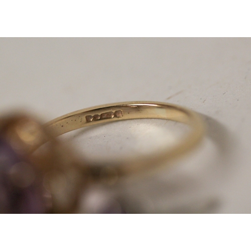382 - A 9ct gold single stone amethyst ring, ring size N, 3.9 grams, and a pair of amethyst stud earrings