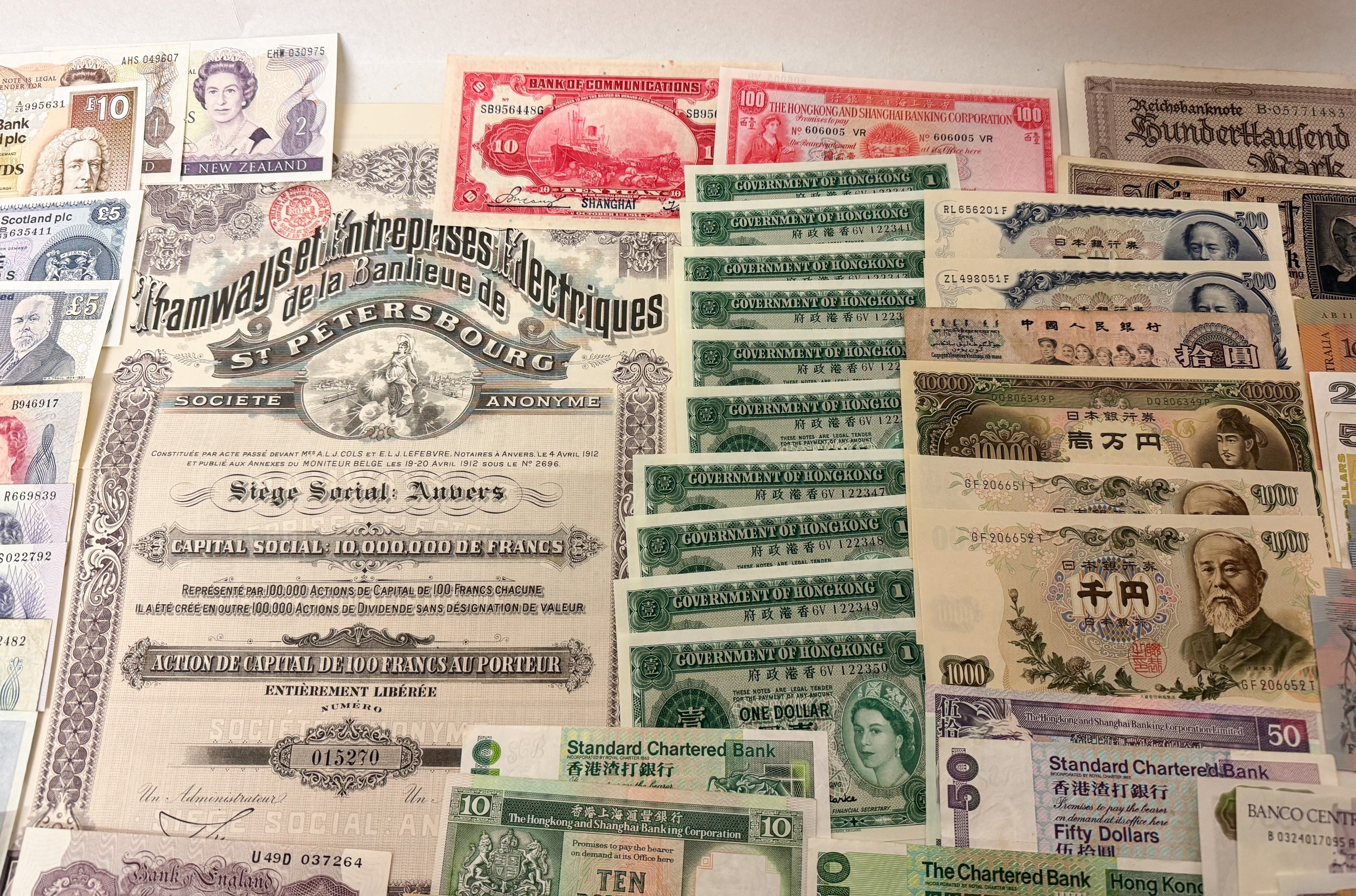 A large collection of English and foreign bank notes, share ...