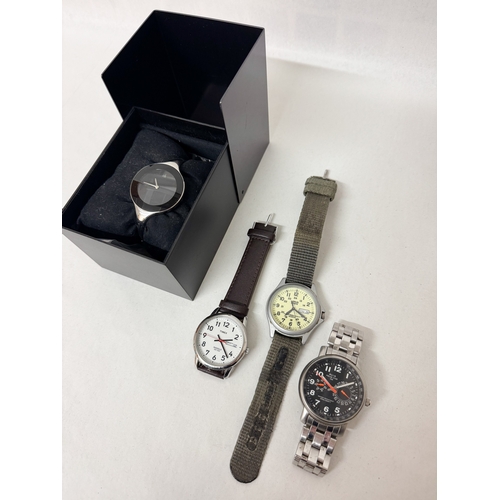 552 - A boxed ladies Calvin Klein wrist watch together with three gent's quartz wrist watches to include A... 