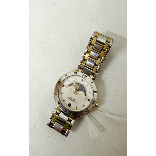 559 - A gent's Seiko Presage Moonphase date quartz wrist watch on a stainless steel and gilt strap, number... 