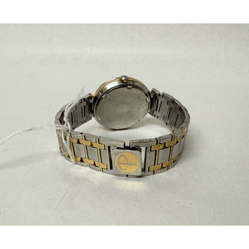 559 - A gent's Seiko Presage Moonphase date quartz wrist watch on a stainless steel and gilt strap, number... 