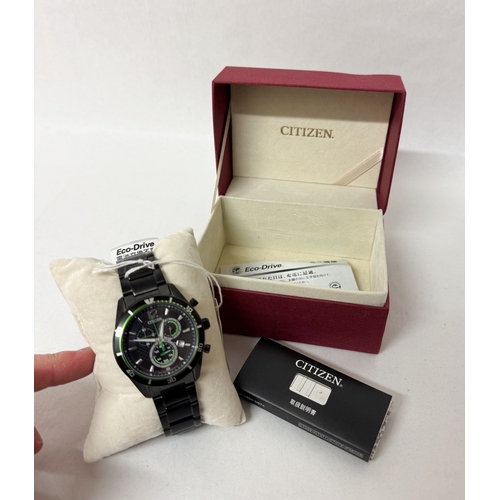 565 - A new gent's Citizen quartz date wrist watch on a black stainless steel strap with box and paperwork... 