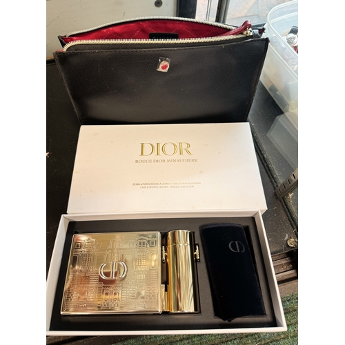 Rouge Dior minaudiere containing gilt metal cosmetic boxes, apparently ...
