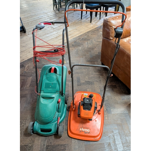 A Flymo L400 self-propelled petrol engine lawnmower together with an ...