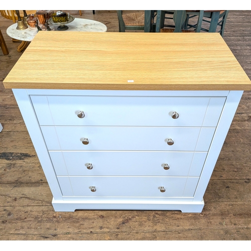18 - A modern white chest of four drawers with light oak top, fitted with chrome knob handles, 3' wide...