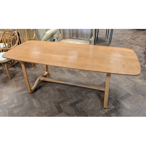2 - An Ercol blond elm refectory style dining table, model number 513.... Top measures 6'6 x 31 1/2