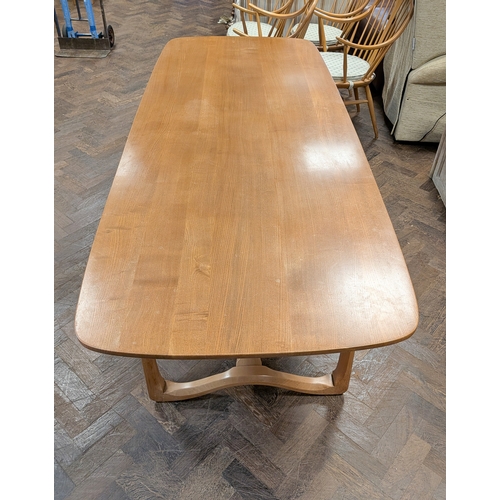 2 - An Ercol blond elm refectory style dining table, model number 513.... Top measures 6'6 x 31 1/2