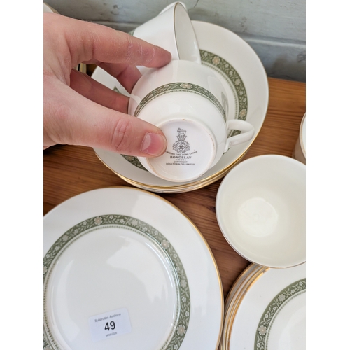 49 - A Royal Doulton Rondelay pattern green and gilt bordered tea set...