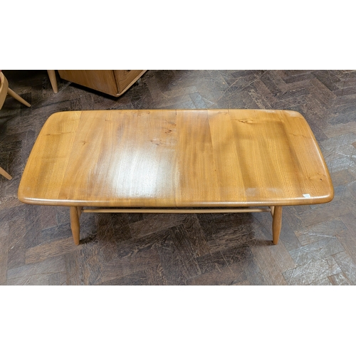5 - A long Ercol blond elm coffee table with under shelf...