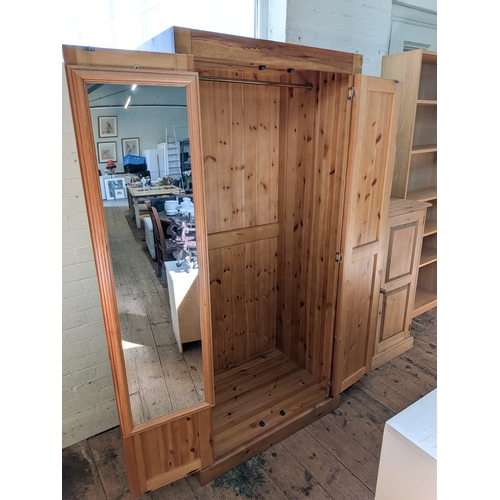 51 - A modern pine two door wardrobe, 3' wide...